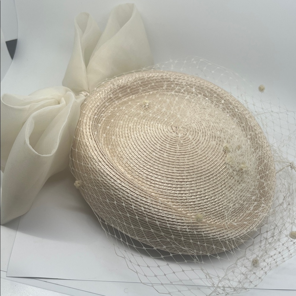 Elegant Cream Fascinator with Bow and Netting